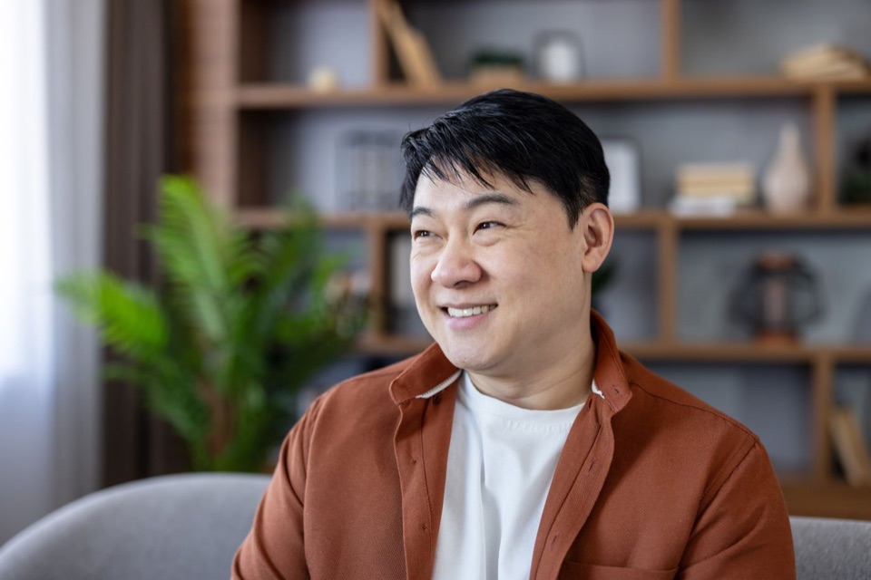 Smiling man relaxing at home