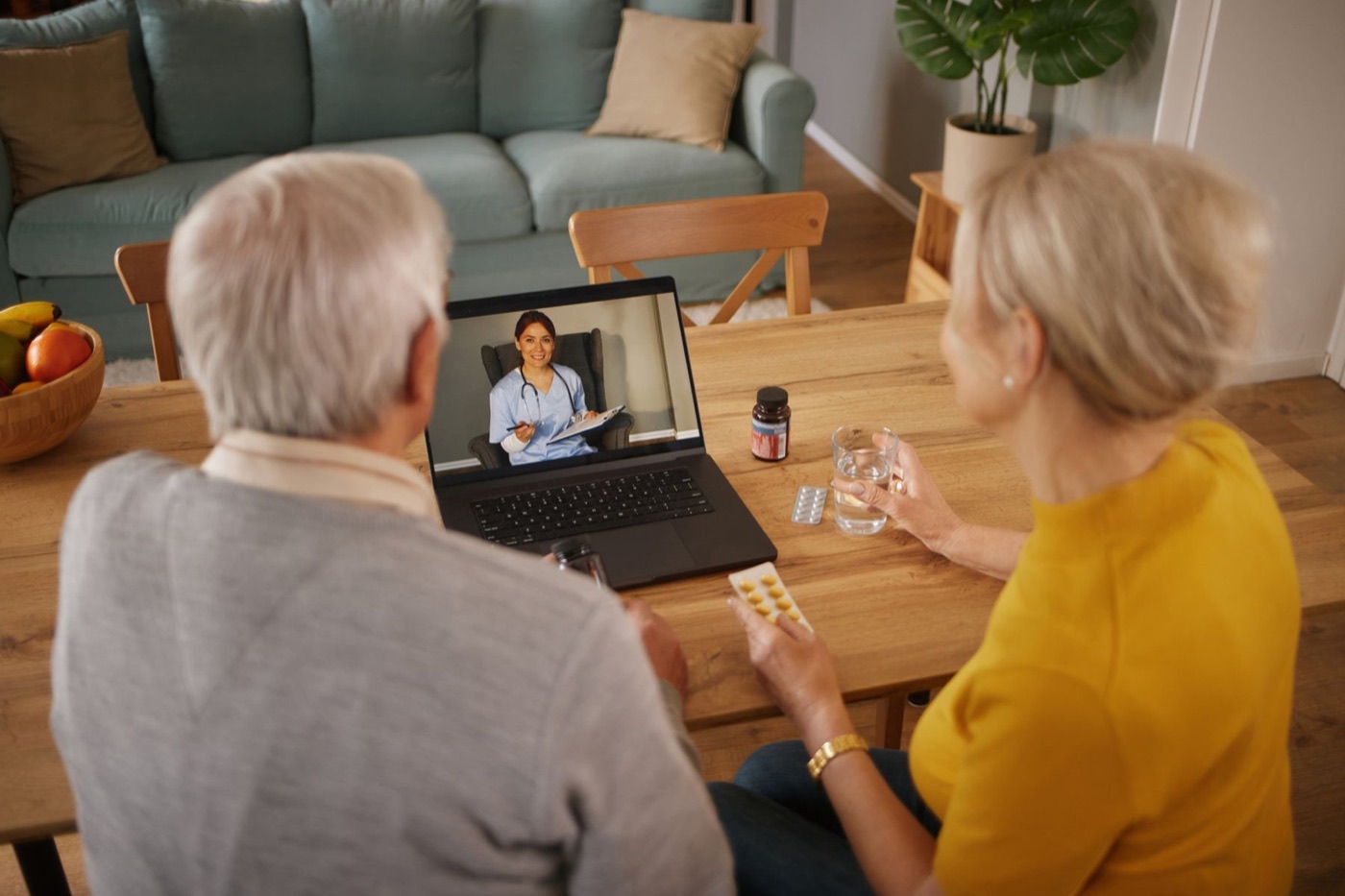 Couple at their kitchen table on a video visit